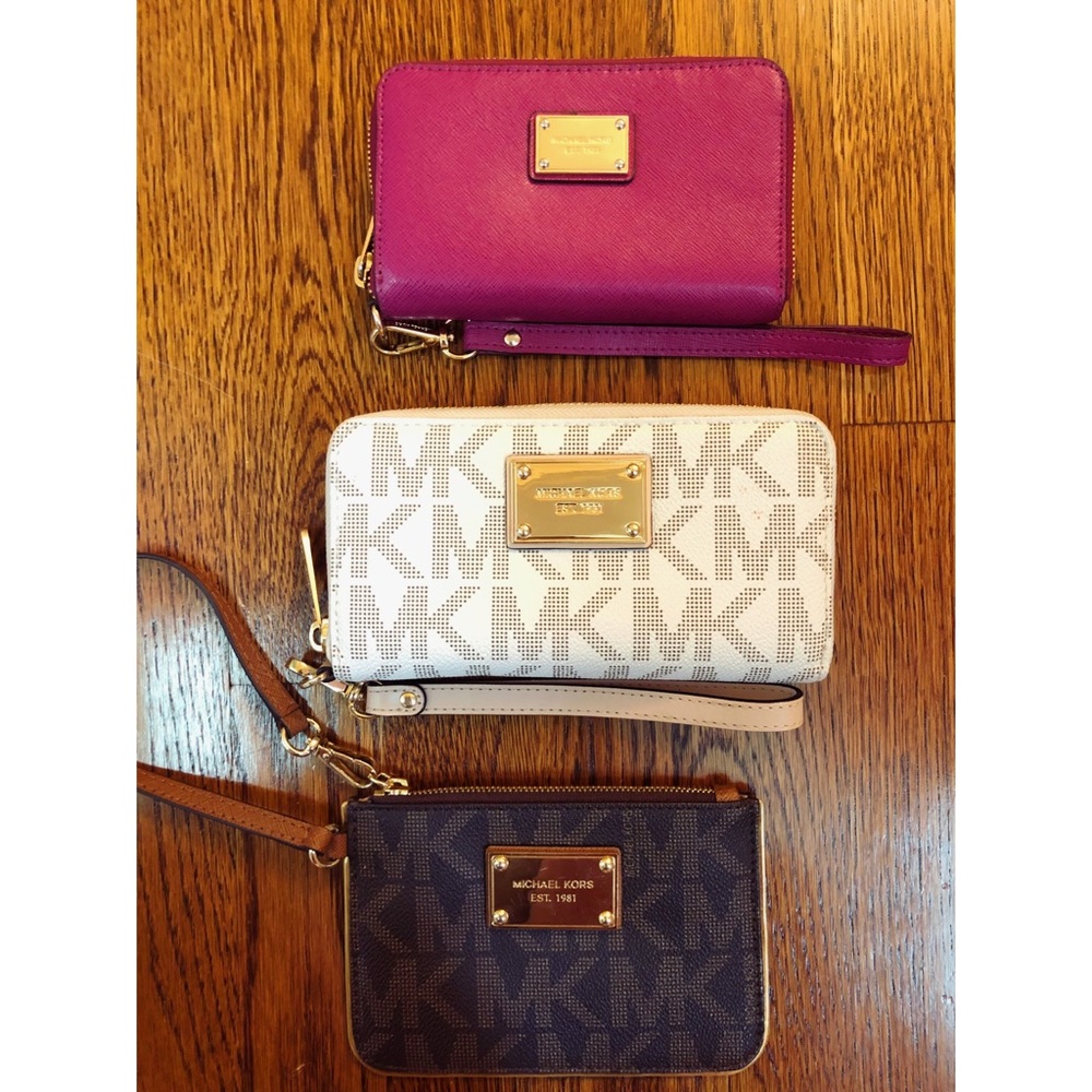 3 Michael Kors wristlets.